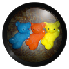 a picture of 3 plastic bears, blue, orange, and yellow
